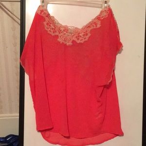 Orange/red blouse with flower design on back